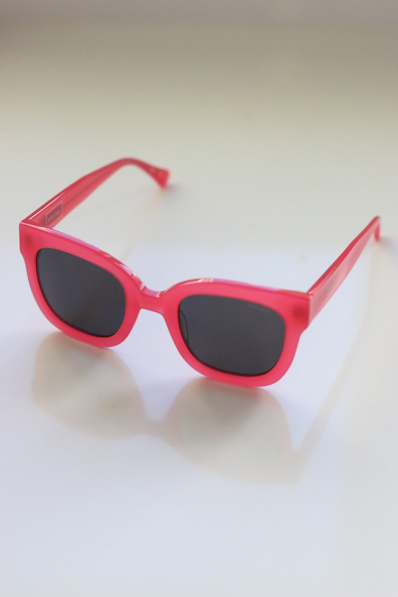 Sundown Pink Sunglasses - Vibrant pink shades reminiscent of a Texan sunset.