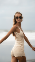 Load image into Gallery viewer, Woman at the beach wearing ANEA HILL First Class Sunglasses - black and white Havana acetate, silver-tone metal
