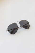 Load image into Gallery viewer, Sail Silver Aviator Sunglasses from ANEA HILL - a luxurious fashion accessory with a silver-tone metal frame, dark-gray tinted lenses, and exquisite attention to detail.
