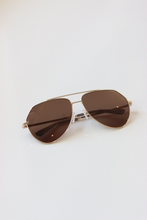 Load image into Gallery viewer, Close-up of gold-tone arm, bridge, and hinges of Aviator luxury Sunglasses
