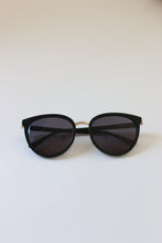 Load image into Gallery viewer, A classic and timeless pair of luxury sunglasses from London with a black frame and grey tinted lenses.
