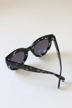 Load image into Gallery viewer, Close-up of ANEA HILL Dynasty sunglasses, highlighting the silver-tone hinges
