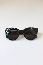 Load image into Gallery viewer, Sunglasses for women with black &amp; clear tortoise acetate frames and oversized cat-eye shape.
